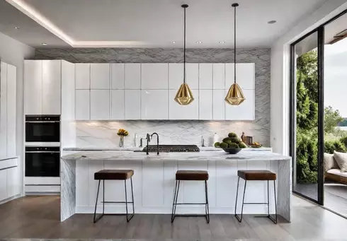 A modern kitchen with sleek white cabinets a large island with afeat