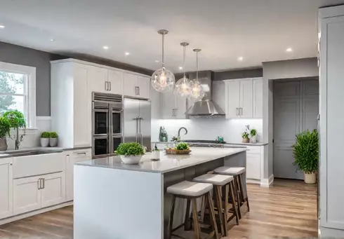 A modern kitchen flooded with natural light featuring sleek white cabinets thatfeat